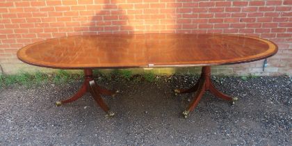 A Regency period and later mahogany twin pedestal dining table of excellent colour