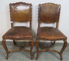 A pair of 19th century walnut Continental side chairs, upholstered in tobacco brown embossed leather