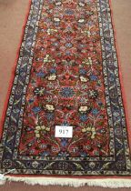 A 20th century Persian runner central, floral pattern on red ground. In good clean condition. .81
