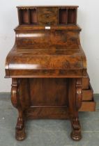 A Victorian burr walnut piano top Davenport, the rising top gallery with three short drawers flanked