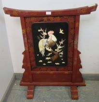 An antique Japanese Shibayama red lacquer fire screen, having applied bone, mother of pearl, abalone