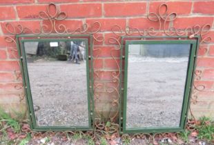 A pair of vintage wrought iron wall mirrors, in ornately scrolled surrounds painted gold and