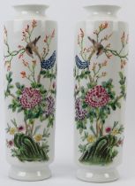 A pair of Chinese famille rose enamelled porcelain rouleau vases, 20th century. (2 items) 32.9 cm