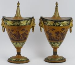 A pair of Tole Peinte japanned tin chestnut urns, early 19th century. Decorated with hand painted