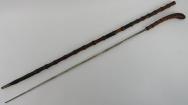 A root handled bamboo swagger sword stick, late 19th/early 20th century. With a single edged