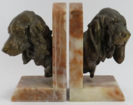 A pair of vintage bronzed spelter and alabaster spaniel and hound dog bookends, 20th century. Both