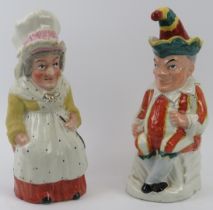 A large pair of rare Staffordshire Punch and Judy jugs with covers. (2 items) 29.5 cm height.