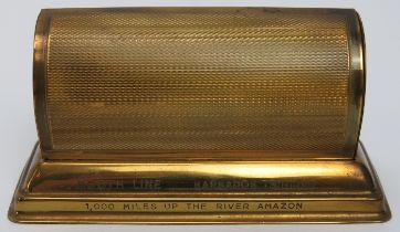 Maritime: A gilt brass perpetual desk calendar from a Booth Steamship Company ship. Inscribed ‘Booth