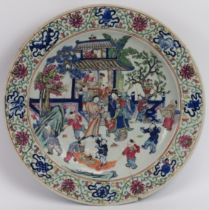 A Chinese Wucai famille rose polychrome enamelled porcelain charger, 19th century. Decorated with