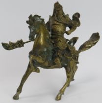 A Chinese solid brass model of a warrior on horseback, 20th century. 18.5 cm height. Condition