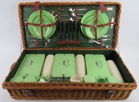 A vintage Coracle picnic wicker hamper set. 76 cm length. Condition report: Light age related wear.