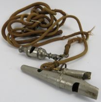 A rare vintage Acme three note double sheep dog whistle. Attached to a chord with an additional