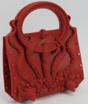 Fashion: A Gabriella Ingram ‘Squeeze Red’ red rubber handbag. Magnetic fastening. 19.5 cm width.