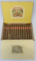 A box of thirteen vintage Partagas Cuban Havana cigars. Each cigar wrapped in cellophane.