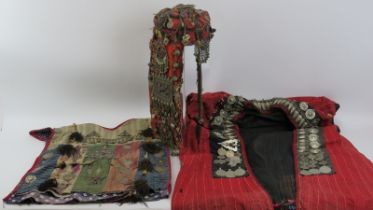 A vintage Bedouin women’s headdress, children's tunic and men's coat, probably 19th century.