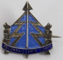 Militaria: A World War II Reconnaissance Corps enamelled silver badge. Struck ‘Sterling’. 2.7 cm