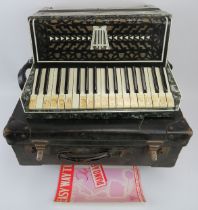 An Italian accordion by Lombardi with case. 44.5 cm approximate width. Case: 49.5 cm width.