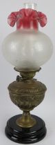 A Late Victorian brass Duplex oil lamp with glass shade and funnel. 52.5 cm height. Condition