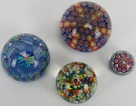 A group of four millefiori glass paperweights, 20th century. Comprising a Vetreria 3 Fiori of Murano