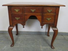 A good quality reproduction cherrywood low boy in the 18th century taste, having a configuration