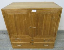 A vintage Japanese cypress wood table-top cabinet, the double doors opening onto two fitted shelves,
