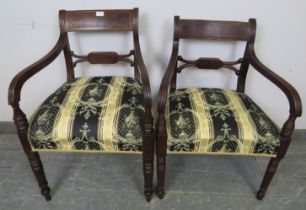 A matched pair of Georgian mahogany elbow chairs, reupholstered in green and gold antique style