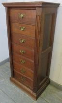 A 19th century oak Wellington chest, having seven long drawers with fancy brass handles, flanked