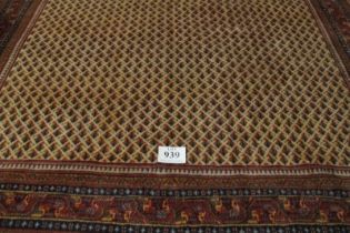 Central Persian Arak carpet. A central repeat pattern arrangement on a cream ground. 310cm x