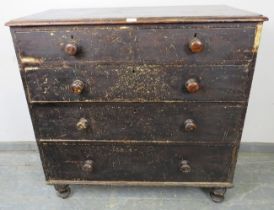 An antique pine chest, having two short over three long graduated drawers with turned wooden