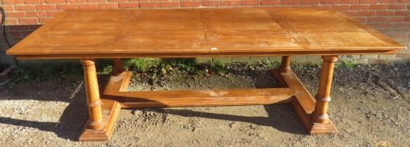 A large bespoke light oak refectory style dining table, planked top on four tapering column