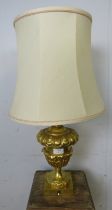 A good quality vintage gilt brass table lamp, having relief acanthus decoration in the Classical