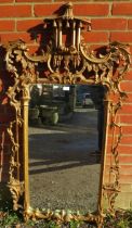 A large vintage wall mirror in the Chippendale taste, within a highly decorative acanthus carved and
