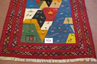 South West Persian Qashqai Kilim rug. A colourful happy rug with styalised animals and bold colours.