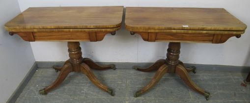 A pair good Regency Period mahogany turn over tea tables, on baluster turned pedestals with reeded