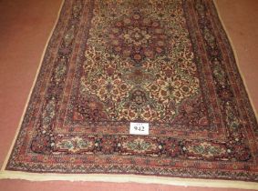 Mid 20th century Persian rug, Naim central motif, cream on brown ground, 208cm x 135cm (approx).