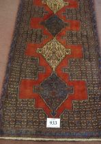 A North West Persian Senneh runner. Central 9 linked diamond motif on claret ground. 330cm x 90cm (