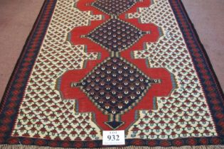 A North West Persian Senneh Kilim rug. Three central linked diamond pattern on a red ground. Good