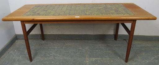 A mid-century Danish teak rectangular coffee table, the top with inset green tiles, on turned