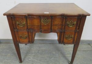 729 A good 18th century serpentine fronted mahogany low boy, possibly Irish, housing one long and