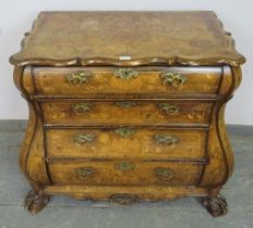 An antique 18th century style Dutch walnut bombe-shaped chest, decorated with profuse marquetry