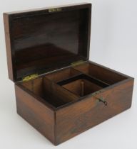 A rosewood storage box, late 19th/early 20th century. With a compartmented interior. 15.9cm