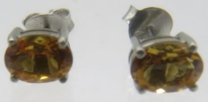 A pair of white metal stud earrings, backs marked 925. Approx weight 1.7 grams. Condition report: