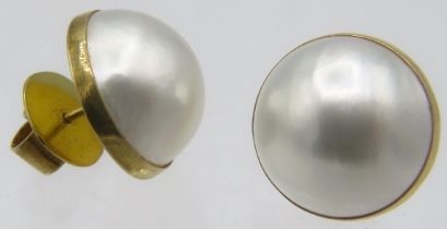 A pair of 9ct yellow gold Mabe pearl earrings, approx 15mm across with butterfly backs. Approx
