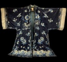 A Chinese ladies embroidered silk robe, 19th century. With Peking knot and silk sewn elaborate