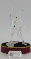 A Swarovski ‘Masquerade Pierrot’ crystal glass figurine, 1999 SCS edition. Glass plaque, stand,