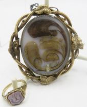 A pinchbeck swivel mourning brooch with finely placed hair & seed pearl decoration with the