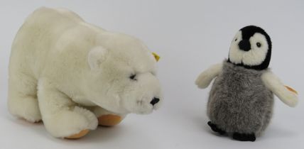 Toys: A Steiff Polar Bear and baby penguin. (2 items) Polar bear: 29.5 cm approximate length.