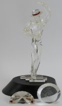 A Swarovski ‘Magic of Dance Antonio’ crystal glass figurine, 2003 SCS edition. Glass plaques, stand,