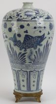 A large Chinese Ming dynasty style blue and white porcelain meiping vase, 20th century. Decorated