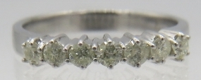 An 18ct white gold seven stone diamond ring, round brilliant cut diamonds, approx 0.50cts, size O.